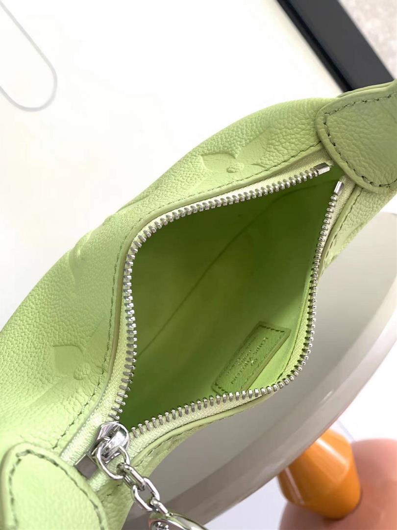 The M82391 M82519 Mini Moon handbag is made of soft Monogram Imprente embossed leather al