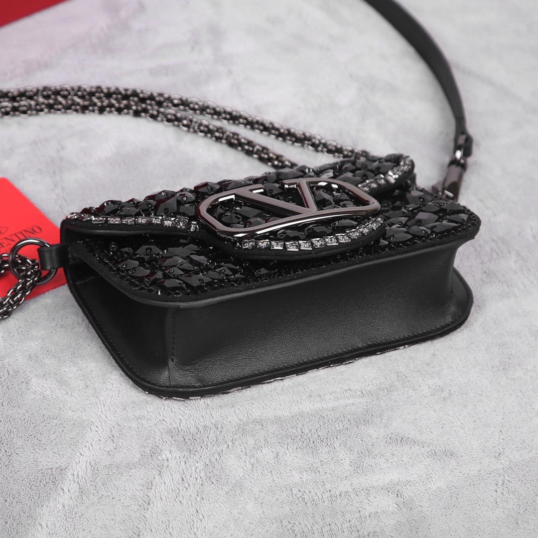 Crystal style The Valentino Garavani Mini Loc handbag is adorned with crystals and Vlogo S