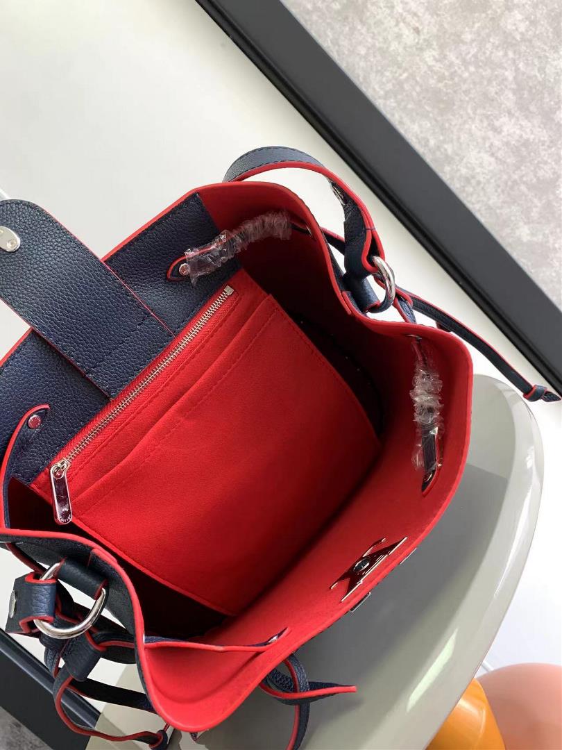 M54677s latest water bucket bag features imported soft calf leather with a shiny twist lo