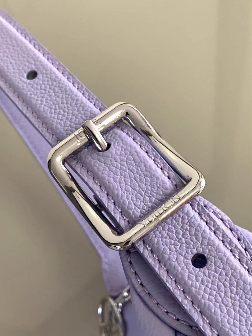 The M82391 M82519 Mini Moon handbag is made of soft Monogram Imprente embossed leather al