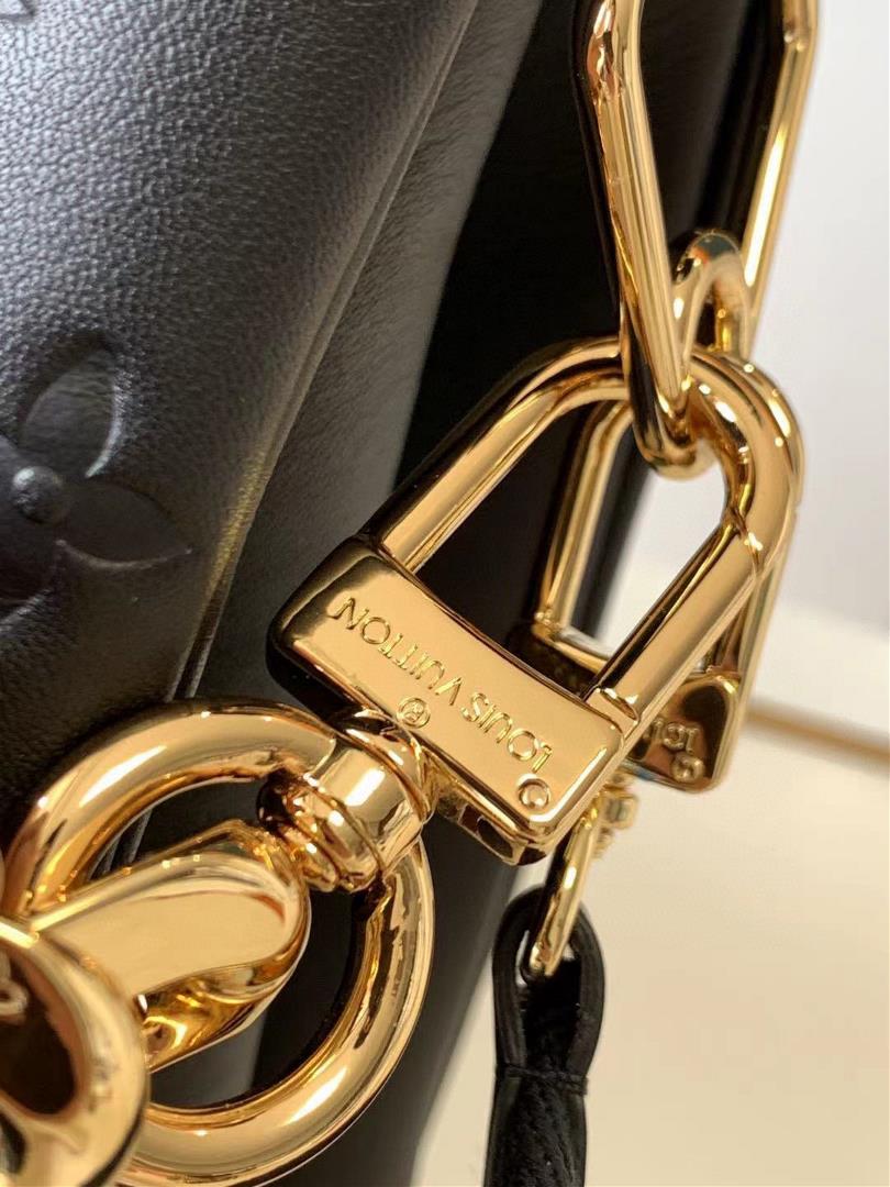 M57783 M57782 Cousin Medium Handbag Monogram embossed fluffy sheepskin creates a soft text